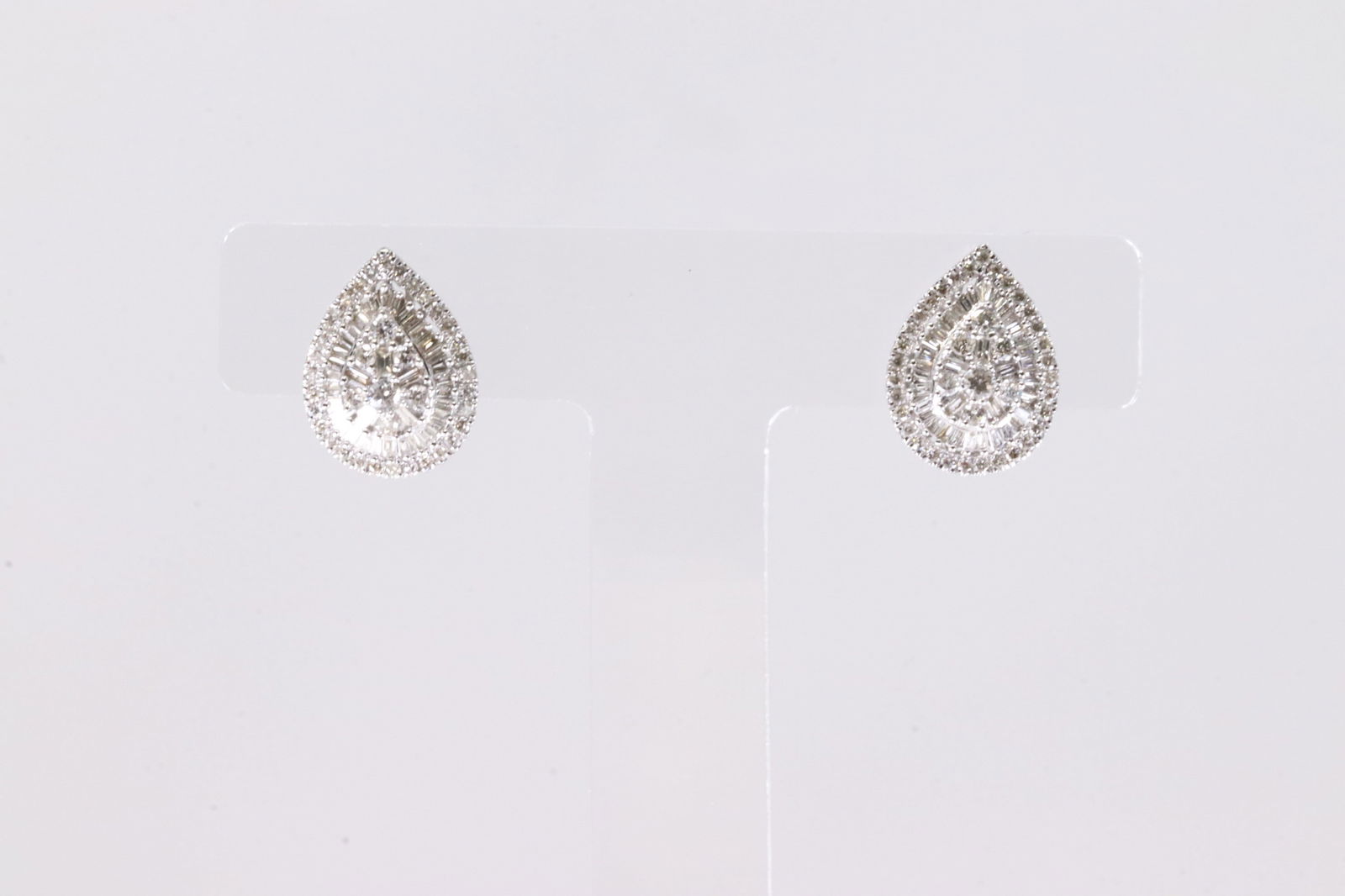 Diamond Stud Earring 10Kt.: Ladies 10Kt White Gold Diamond Stud Earring. This Elegant Earring's has 78 Round / 82 Baguette Sparkling Diamonds. Diamond Weight Approx: 1.6 ctw Total Weight: 3.25 Grams.