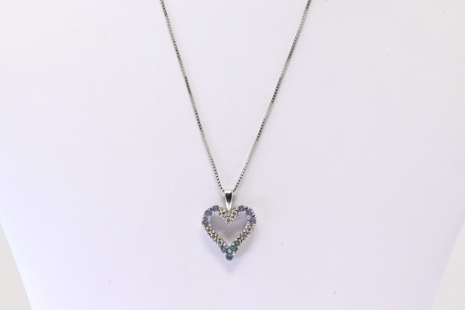 Tanzanite / Aquamarine & Diamond Heart Pendant 14Kt.: Ladies 14Kt White Gold Tanzanite / Aquamarine & Diamond Heart Pendant. Pendant has Multi-Gemstone with 9 Diamonds & A 14K Necklace. Necklace length: 16.00" Total weight: 4.50 Grams.