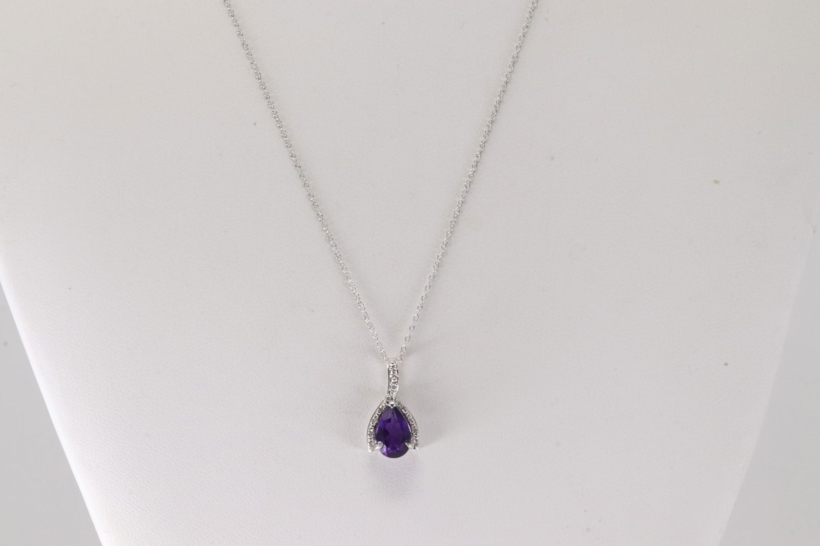 Amethyst & Diamond Pendant / Necklace 10Kt.: Ladies 10Kt White Gold Amethyts & Diamond Pendant / Necklace. This Charming Pendant has Purple Amethyst with Sparkling Diamodns and A 10K Necklace. Diamonds weight: 0.08ctw. Necklace length: 18.00'