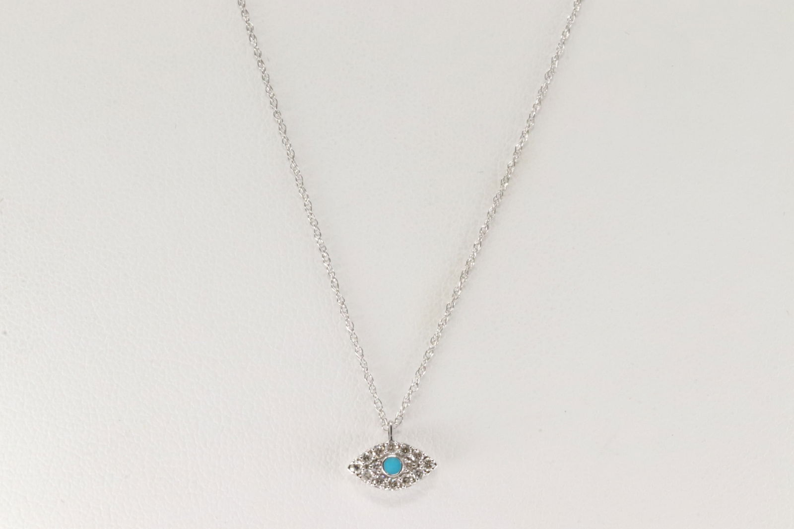 Turquoise & Diamond Eye Evil Pendant / Necklace 14Kt.: 14Kt White Gold Turquoise / Diamond Eye Evil Pendant and Necklace. This Necklace has Eye Evil Pendant with blue Turquoise and 14 Sparkling Diamonds. Diamonds weight: 0.14ctw. Necklace length: 18.00"
