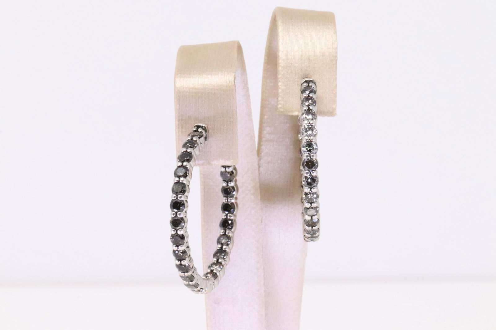 Eternity Hoop Diamond Earring 14Kt.: Ladies 14Kt White Gold Eternity Hoop Diamond Earring. Earring has 44 round White & Champagne Diamonds. Diamonds weight approx: 4.00cttw. Total weight: 10.60 Grams.
