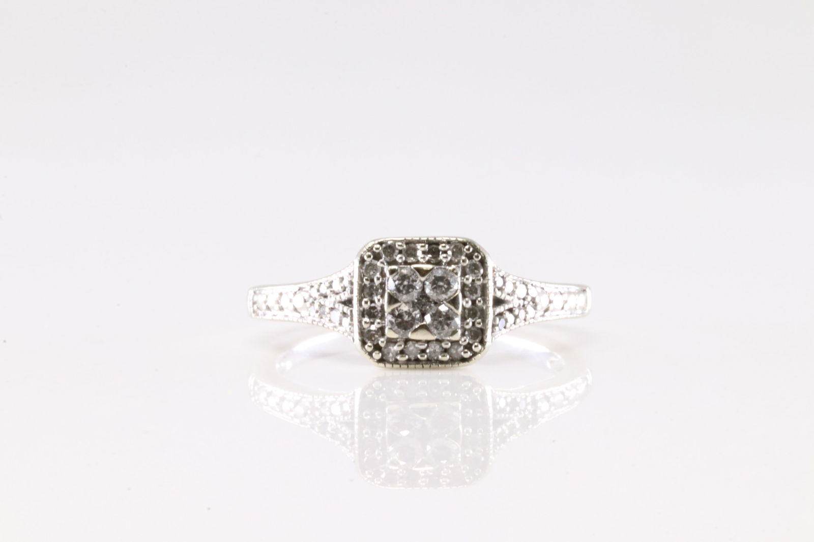 Diamond Ring 10Kt.: Ladies 10Kt White Gold Diamond Ring. This Charming Ring has 36 Round Sparkling Diamonds. Ring Size: 6.00. Total Weight: 2.38 Grams.