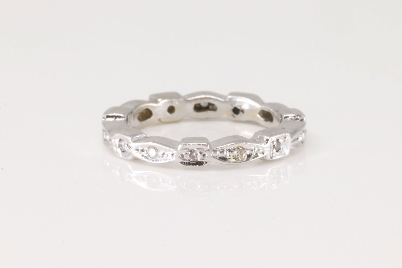 Eternity Diamond Ring 14Kt.: 14Kt White Gold Eternity Diamond Ring. This ring has Eternity design with round diamonds. Ring size: 3.50 Total weight: 2.70 Grams.