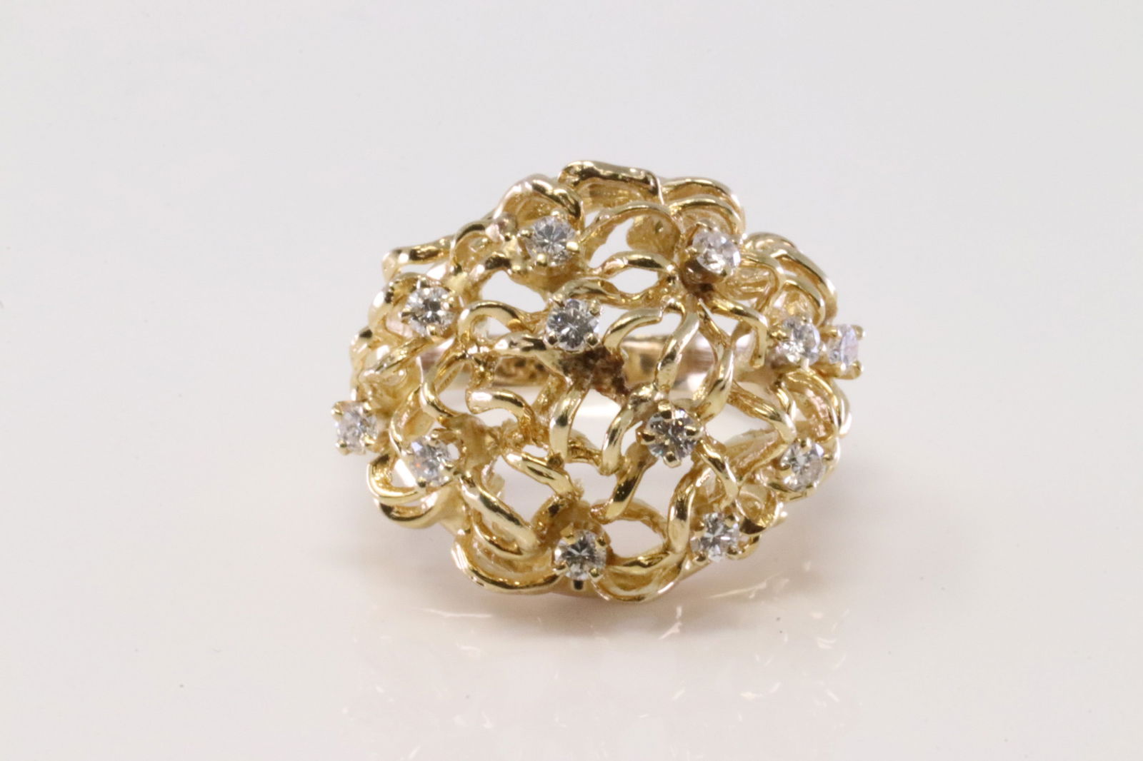 Vintage Diamond Ring 14Kt.: Ladies 14Kt Yellow Gold Diamond Ring. Ring has a design with 12 round Diamonds. Diamonds weight: 0.50ctw approx. Ring size: 7.00. Total weight: 9.20 Grams.