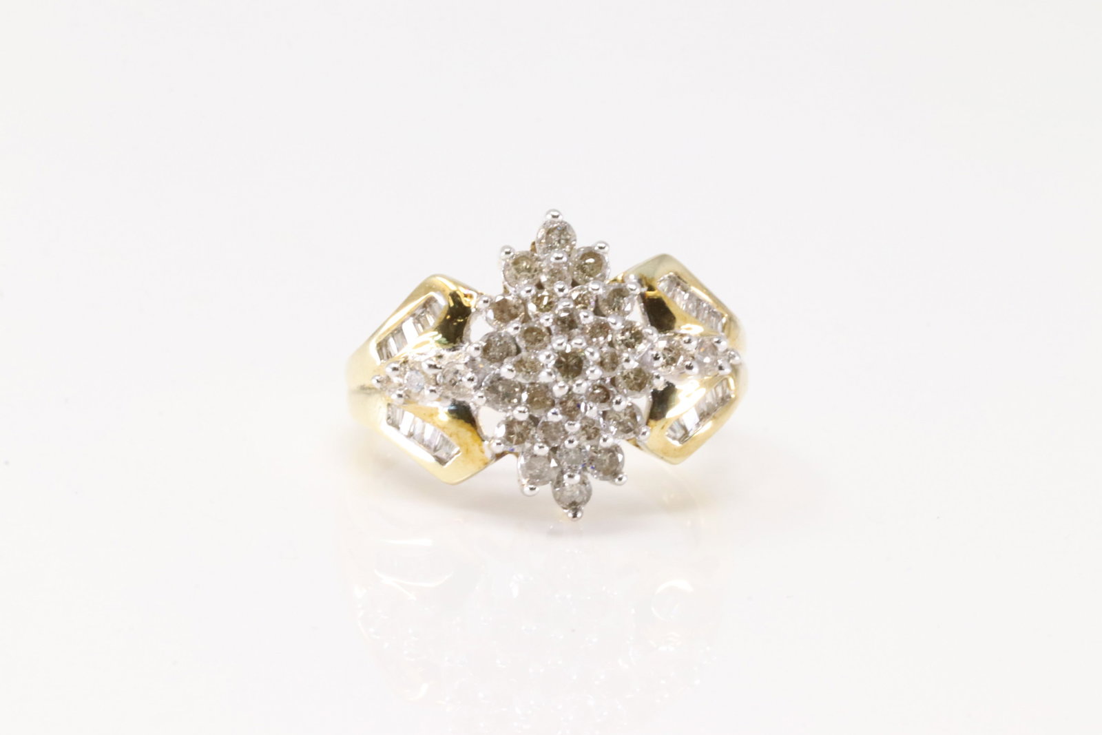 Ladies Cocktail Diamond Ring 10Kt.: Ladies 10Kt Yellow Gold Diamond Ring. This Charming Ring has 35 Round / 20 Baguette Sparkling Diamonds. Diamonds Weight Approx: 1.00ctw. Ring Size: 7.00. Total Weight: 4.33. Grams.