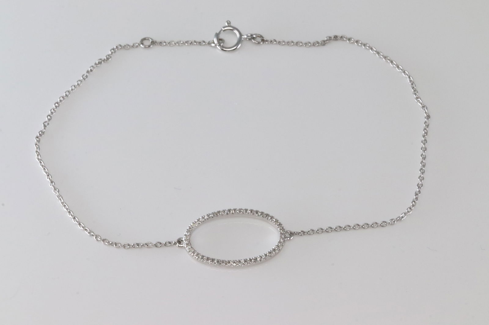 Diamond Bracelet Link 14Kt.: 14Kt White Gold Diamond Bracelet Link. This Link Bracelet has Circle Design with Sparkling Diamonds. Diamonds weight: 0.07ctw. Bracelet length: 8.00"