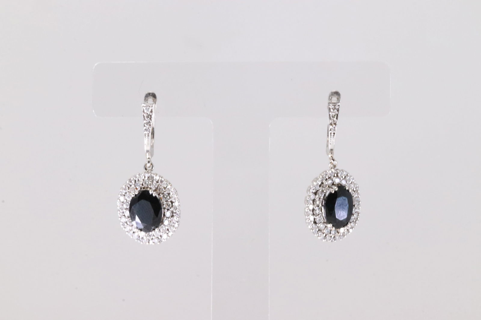 Black Onyx & Diamond French Hoop Earring 18Kt.: Ladies 18Kt White Gold Black Onyx & Diamond French Hoop Earring. This Elegant Earring's has Black Onyx & 116 Round Sparkling Diamonds. Diamond Weight Approx: 2.30 ctw Total Weight: 6.19 Grams.