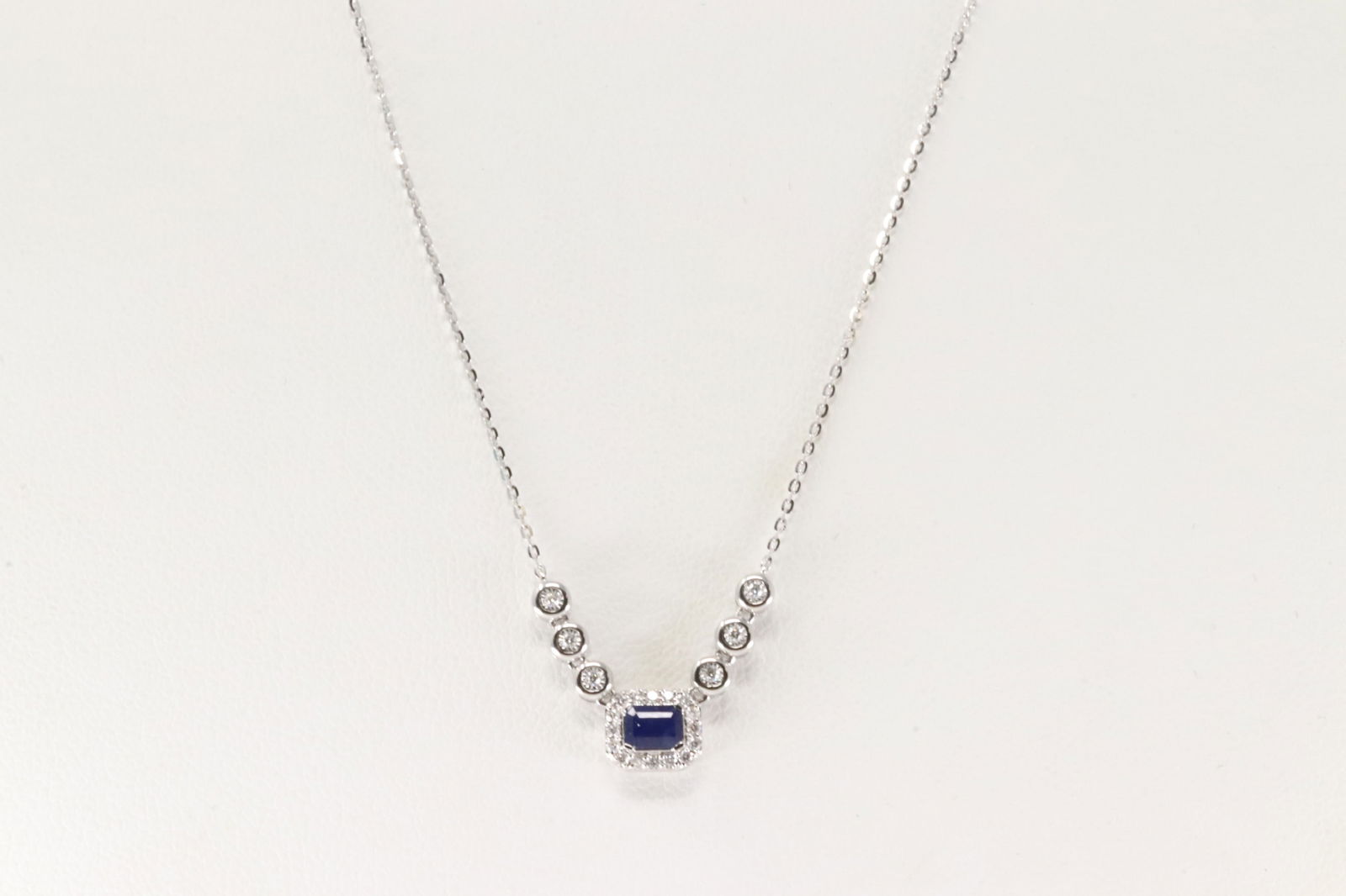 Sapphire & Diamond Necklace 14Kt.: Ladies 14Kt White Gold Sapphire & Diamond Necklace. This Necklace has Charm with Blue Sapphire and Brilliants Diamonds. Diamonds weight: 0.11ctw. Sapphire weight: 0.29ctw. Necklace length: 18.00"
