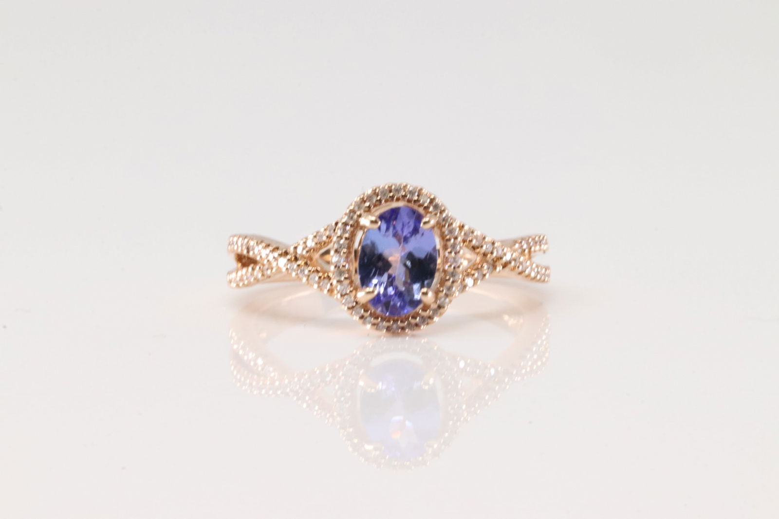 Amethyst & Diamond Ring 10Kt.: Ladies 10Kt Rose Gold Amethyst & Daimond Ring. This Charming Ring has Oval Amethyst surrender By Sparkling Diamonds. Diamonds weight: 0.18ctw. Gemstone weight: 0.87ct. Ring size: 7.00.