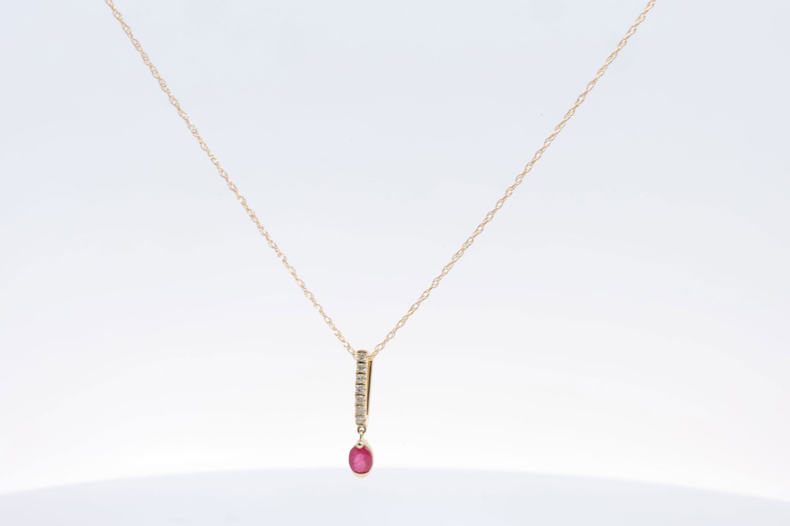 Ruby & Diamond Pendant / Necklace 14Kt.: Ladies 14Kt Yellow Gold Ruby & Diamond Pendant / Necklace. Necklace has Pendant Oval Ruby with 7 round Diamonds. Diamonds weight: 0.05ct. Necklace length: 18.00"