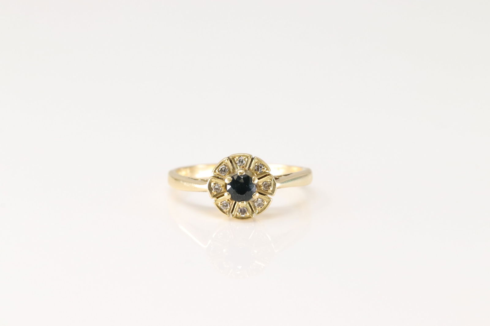 Sapphire & Diamond Ring 18Kt.: Ladies 18Kt Yellow Gold Sapphire & Diamond. This Charming Ring has round Sapphire Surrender By 8 Sparkling Diamonds. Ring size: 6.25. Total weight: 3.60 Grams.