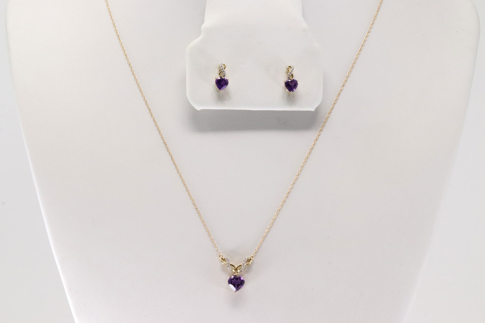 Amethyst & Diamond Necklace & Earring Set 10Kt.: Ladies 10Kt Yellow Gold Amethyst & Diamond Necklace & Earring Set. This Elegant Sety has Necklace & Stud Earring's with Amethyst Heart-Shaped and Sparkling Diamonds. Diamodns weight: 18.00"