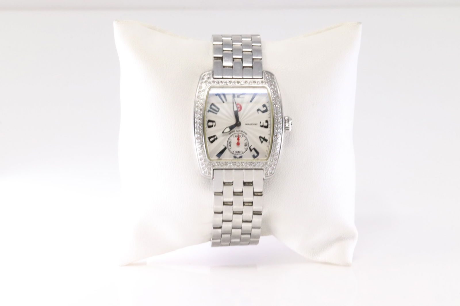 Michele Swiss Diamond Bezel Watch – Model MW02A01: Michele Mini Urban Diamond Watch. Mini Urban In Stainless Steel Case And Bracelet. Synthetic Sapphire Crystal. Silver Guilloche Dial With Arabic Numerals. 114 Total Diamonds. Diamond Weight Approx: