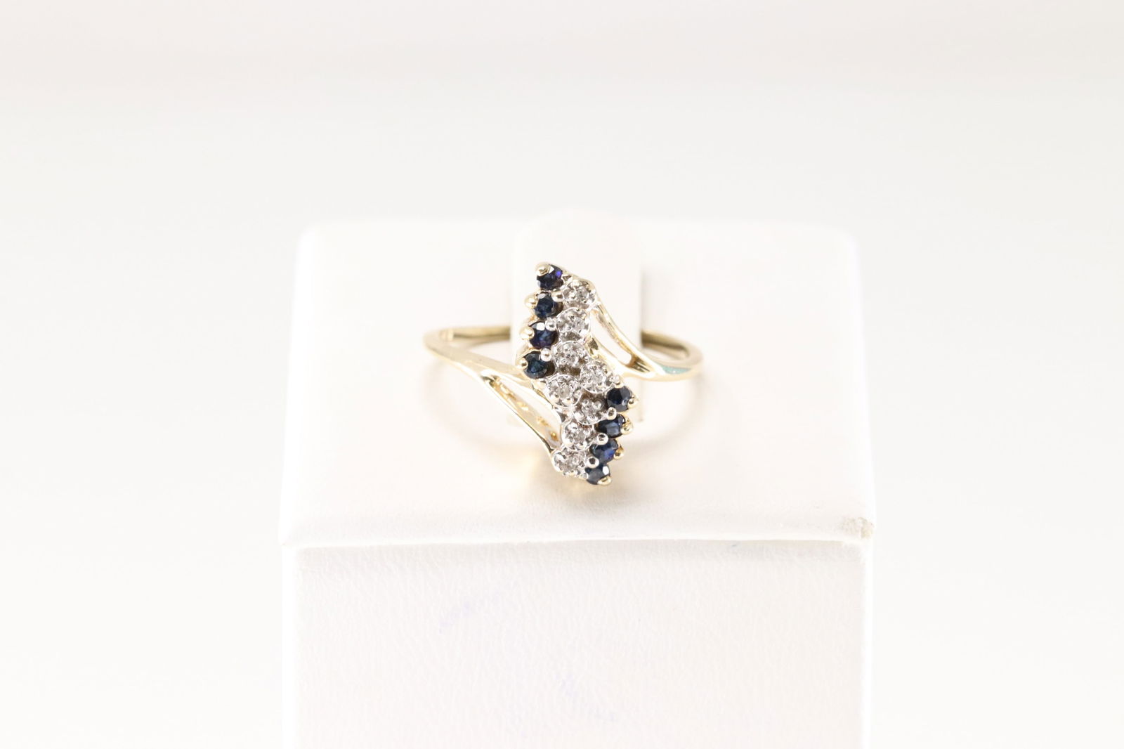 Sapphire & Diamond Ring 14Kt.: Ladies 14Kt Yellow Gold Sapphire & Diamond Ring. This Elegant Ring has 8 Blue Sapphires with 8 Sparkling Diamonds. Ring size: 6.00. Total weight: 2.40 Grams.