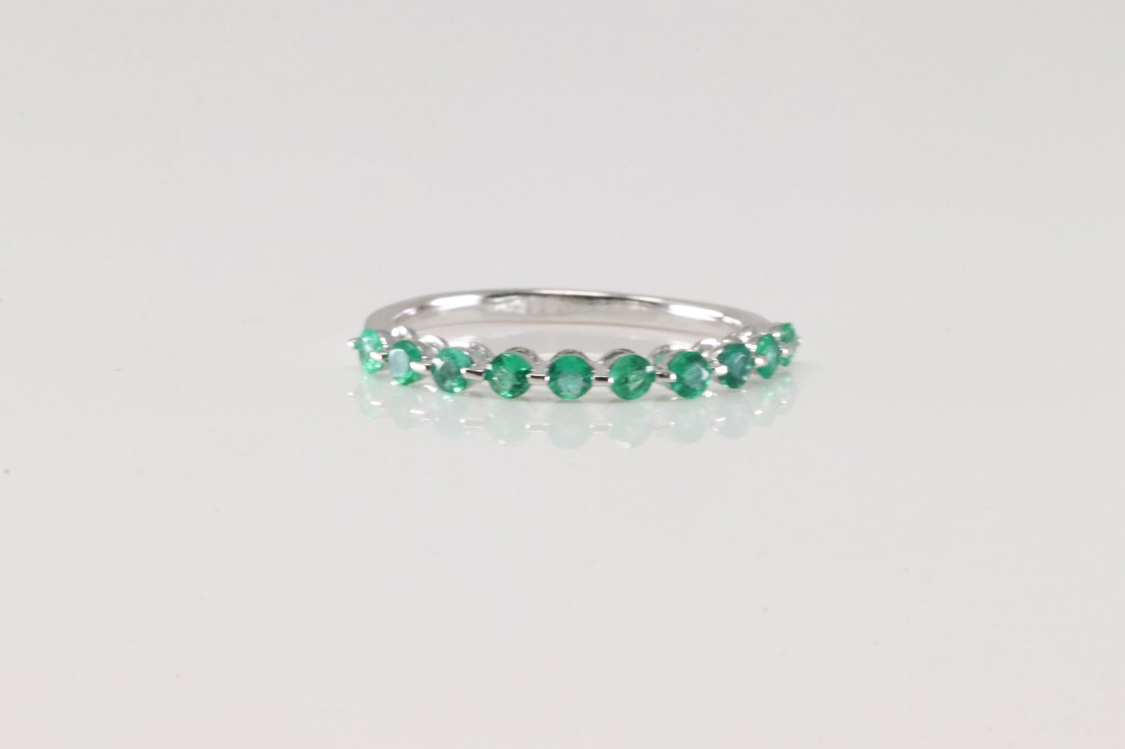 Emerald Ring 10Kt.: Ladies 10Kt White Gold Emerald Ring. This Elegant Ring has round Emeralds. Emeralds weight: 0.65ctw. Ring size: 7.00.