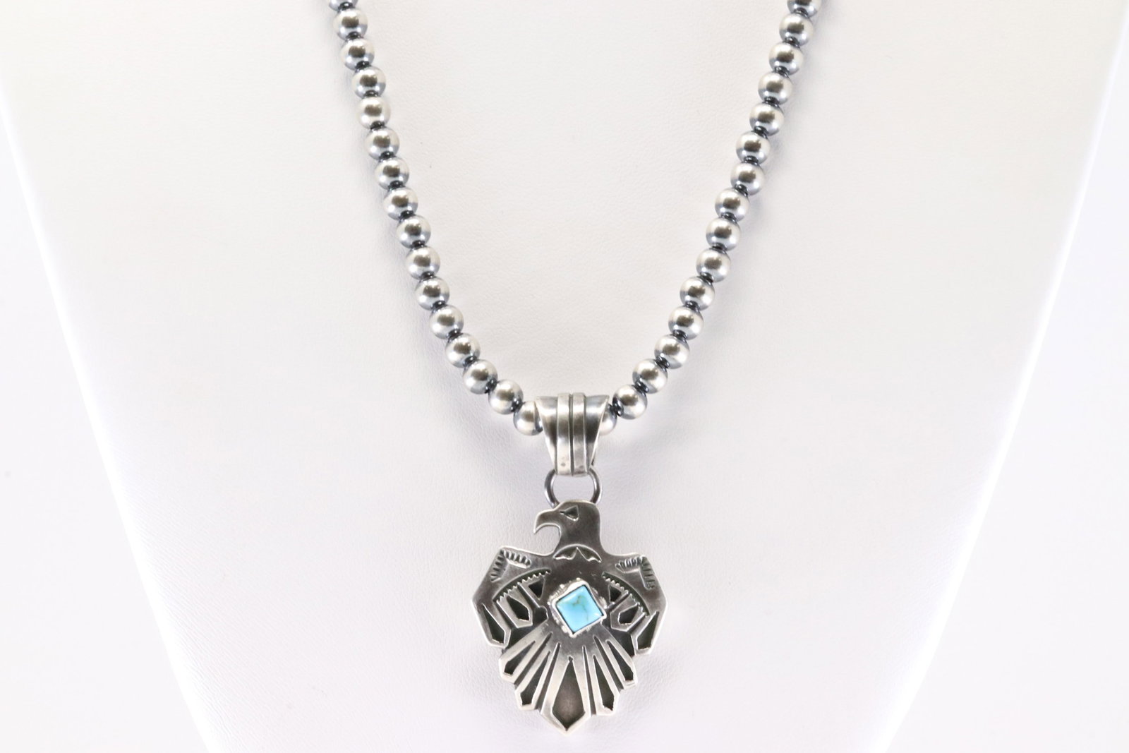 Native America Navajo Sterling Silver Turquoise Thunderbird Pendant By Jerold Joe. with Pearl Beaded: This is a Native America Navajo Sterling Silver Turquoise Thunderbird Pendant By Jerold Joe. with Pearl Beaded Sterling Silver Machine Made Necklace. Necklace length: 18.00"