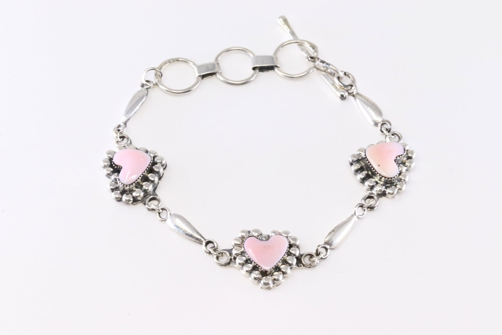 America Sterling Silver Pink Conch Shell Heart Bracelet Link.: This is a America Sterling Silver Pink Conch Shell Heart Bracelet Link. Bracelet length: 9.00" Adjustable.