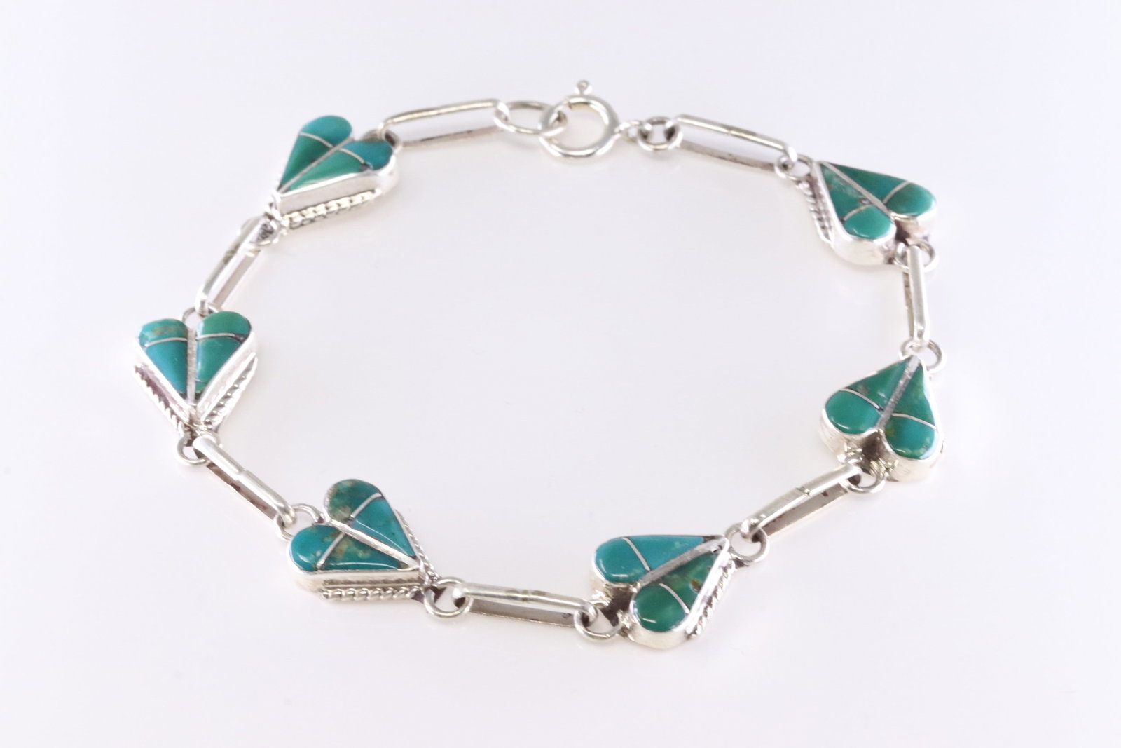 Native America Zuni Sterling Silver Turquoise Inlay Bracelet Link By RVN.: This is a Native America Zuni Sterling Silver Turquoise Inlay Bracelet Link By RVN. Stamp RVN. Bracelet Length: 7.50.