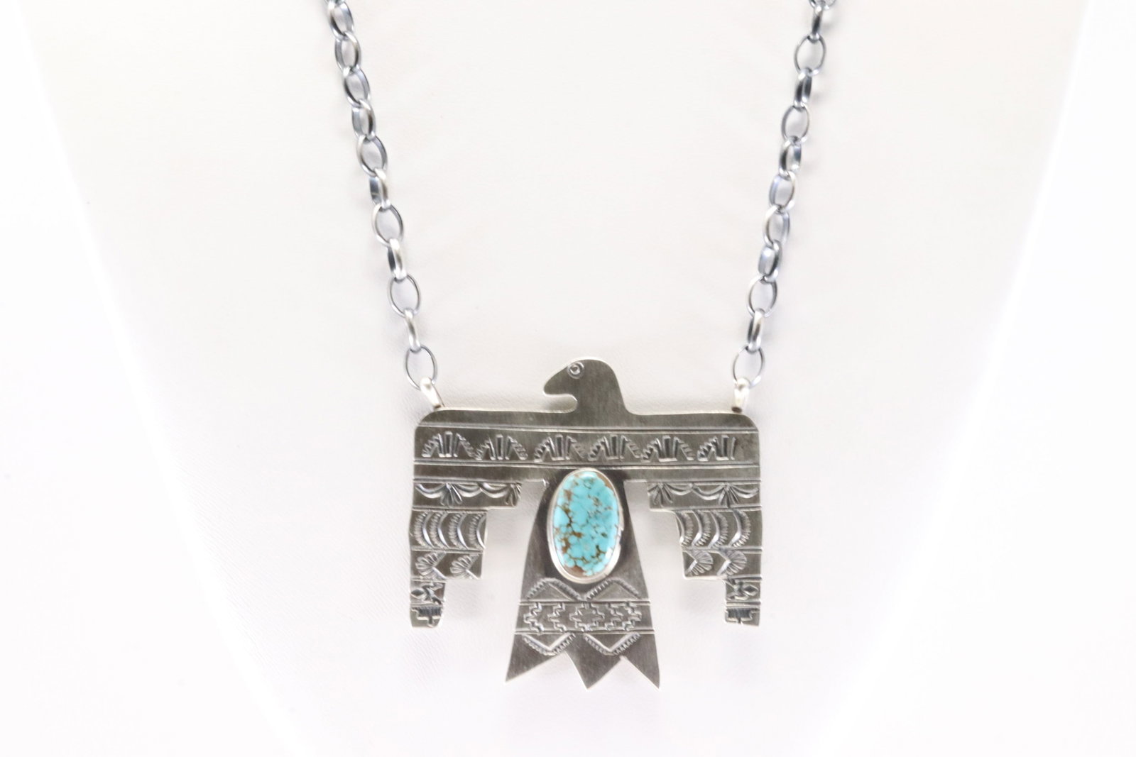Native America Navajo Sterling Silver Number 8 Turquoise Thunderbird Necklace By Rick Enriquez.: This is a Native America Navajo Sterling Silver Number 8 Turquoise Thunderbird Necklace By Rick Enriquez. Stamp RE. Necklace Length: 18.00.