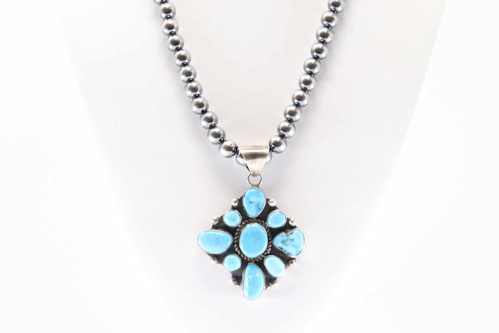Native America Navajo Sterling Silver Kingman Turquoise Pendant By W.D. With Machine Made Stearling: This is a Native America Navajo Sterling Silver Kingman Turquoise Pendant By W.D. With Machine Made Stearling Silver Pearl Beaded Necklace. Stamp WD. Necklace length: 18.00"
