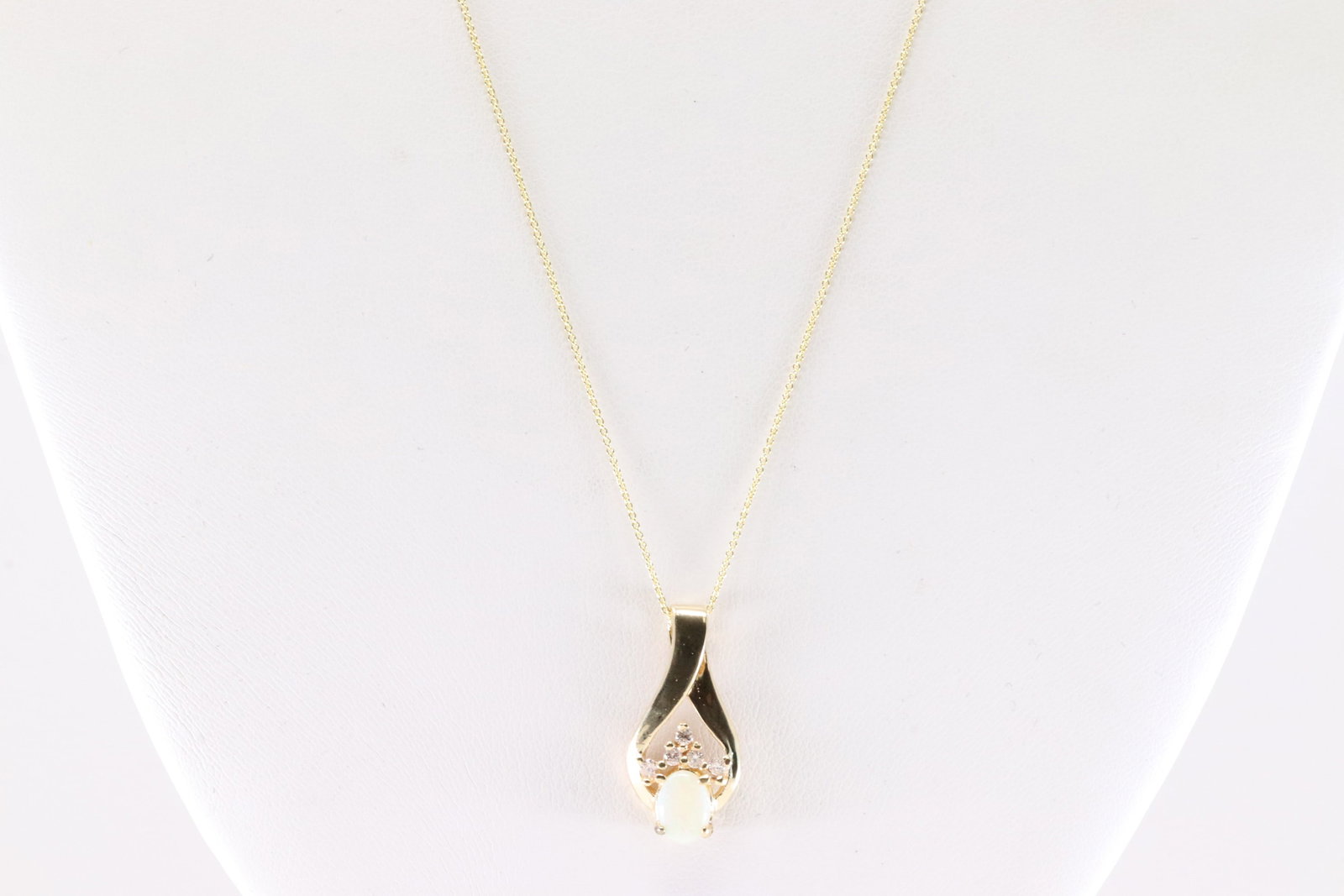 Opal & Diamond Pendant / Necklace 14Kt.: Ladies 14Kt Yellow Gold Opal & Diamond Pendant / Necklace. This Necklace has Opal Pendant With 5 Round Sparkling Diamonds. Necklace Length: 20.00. Total Weight: 3.20 Grams.