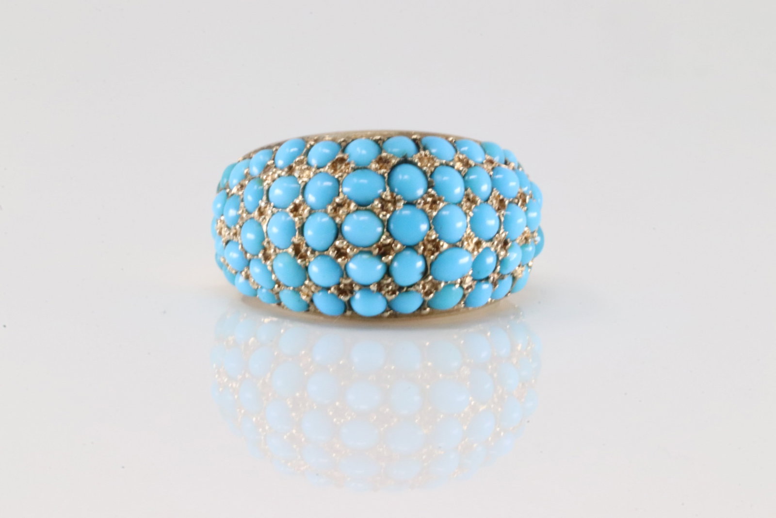 Turquoise Cluster Ring 14Kt.: Vintage Ladies 14Kt yellow Gold Turquoise Cluster Ring. This ring has cluster blue round turquoise. Ring size: 5.25. Total weight: 5.60 Grams.