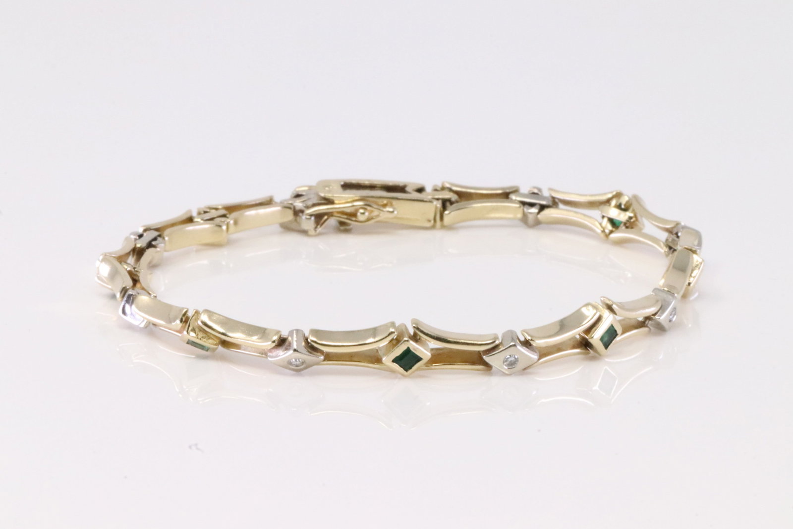 Emerald & Diamond Bracelet 14Kt.: 14Kt Yellow Gold Emerald & Diamond Bracelet. Bracelet has 8 Green Emerald with 8 round Diamonds. Bracelet length: 7.50" Total weight: 16.40 Grams.