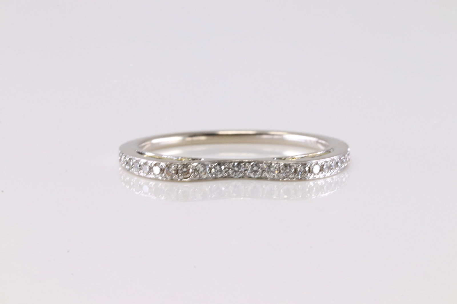 Diamond Ring 18Kt.: Ladies 18Kt White Gold Diamond Ring. This Charming Ring has 22 Round Sparkling Diamonds.Ring Size: 6.75. Total Weight: 2.10 Grams.