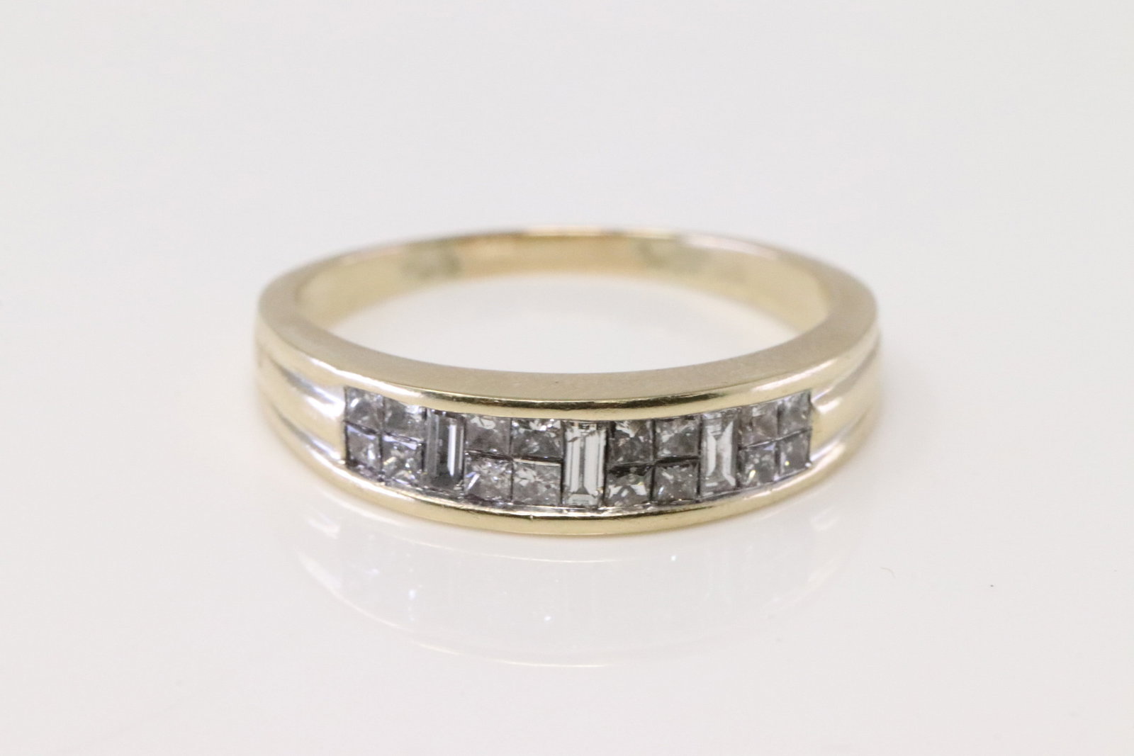 Diamond Ring 14Kt.: 14Kt Yellow Gold Diamond Ring. Ring has 19 Cut Diamonds with 3 Baguette. Diamonds weigh approx 0.75ctw. Ring size: 8.50. Total weight: 4.10 Grams.