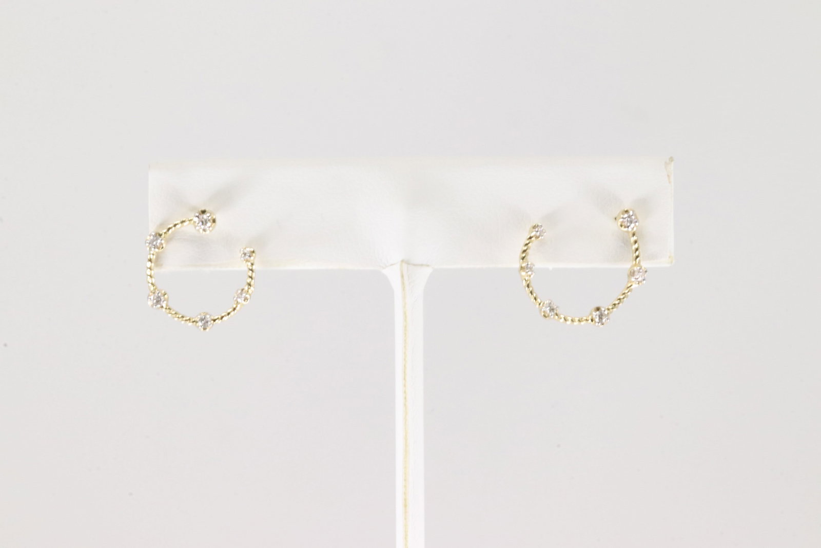 Diamond Hoop Earring 14Kt.: Ladies 14Kt Yellow Gold Diamond Hoop Earring. This Charming Earring's has 12 Sparkling Diamonds. Diamonds weight: 0.18ctw.
