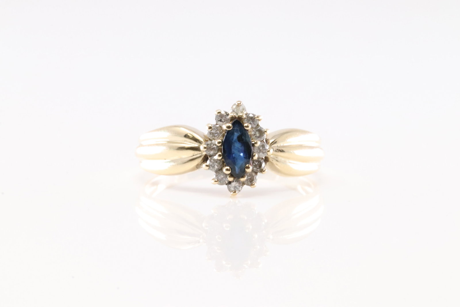 Sapphire & Diamond Ring 14Kt.: Ladies 14Kt Yellow Gold Sapphire & Diamond Ring. This Ring has Beautiful Oval Sapphire Gemstone With 12 Round Sparkling Diamonds. Ring Size: 7.50.