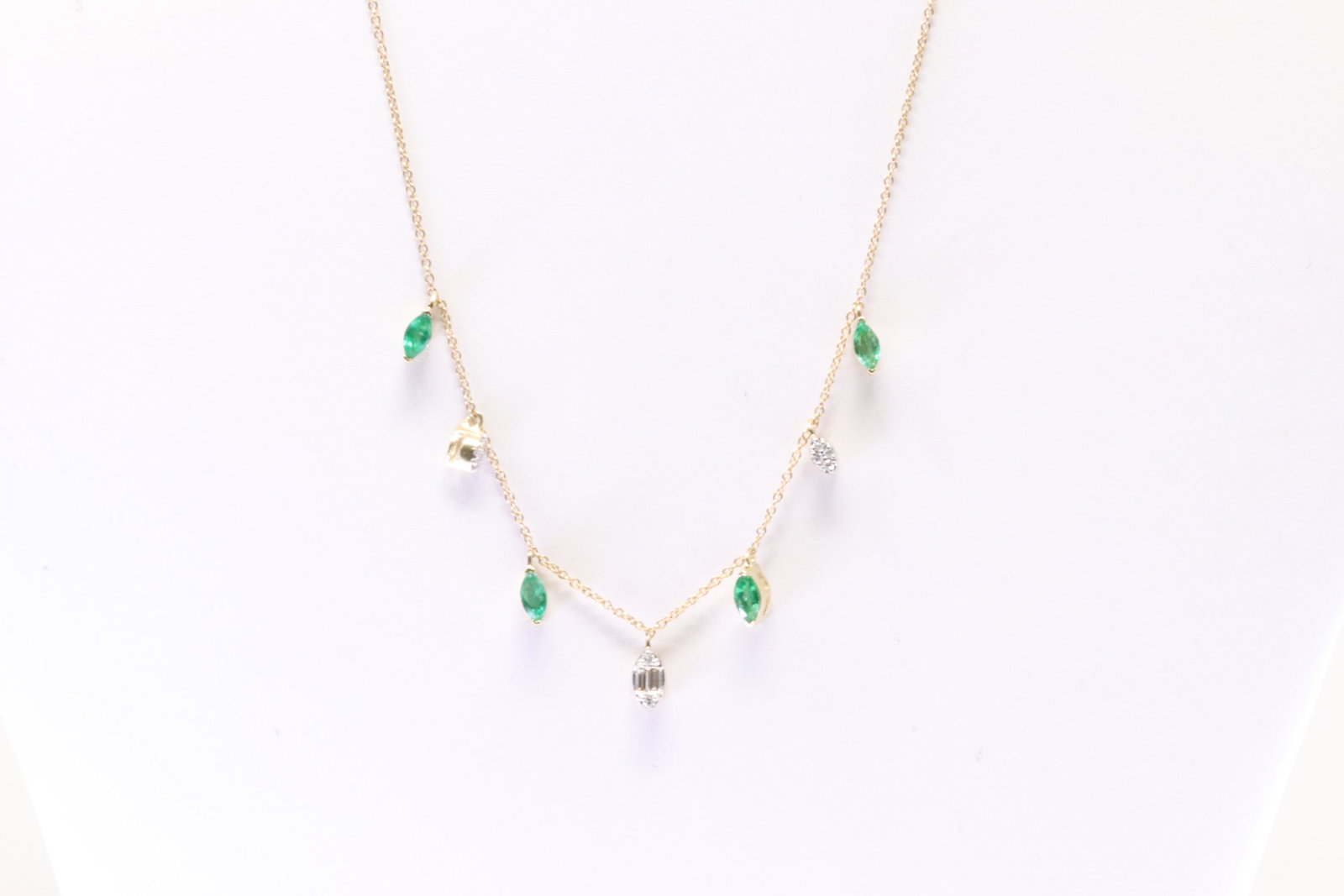 Emerald & Diamond Necklace 14Kt.: 14Kt Yellow Gold Emerald & Diamond Necklace. Necklace has 4 Eemrald's Gems with Baguette & round Diamonds. Diamonds weight: 0.10ct. Eemrald's weight: 58.ct. Necklace length: 18.00" Adjustable. Total