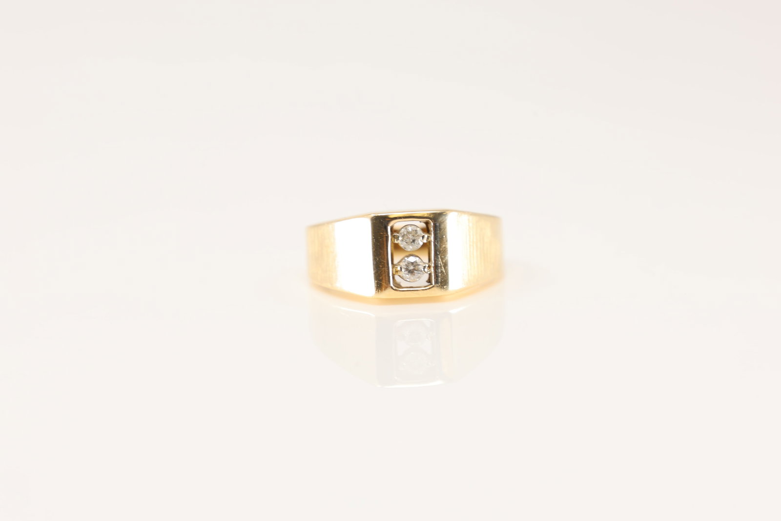 Diamond Ring 14Kt.: 14Kt Yellow Gold Diamond Ring. modern ring design with two sparkling diamonds set in a rectangular frame. this ring is a timeless piece that exudes sophistication and style. Ring size: 8.00. Total wei