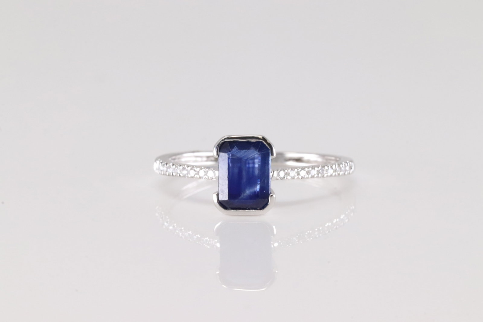 Sapphire & Diamond Ring 14Kt.: Ladies 14Kt White Gold Sapphire & Diamond Ring. This Charming Ring has Blue Sapphire with 18 Sparkling Diamonds. Diamonds weight: 0.11ctw. Sapphire weight: 0.89ct. Ring size: 6.50.