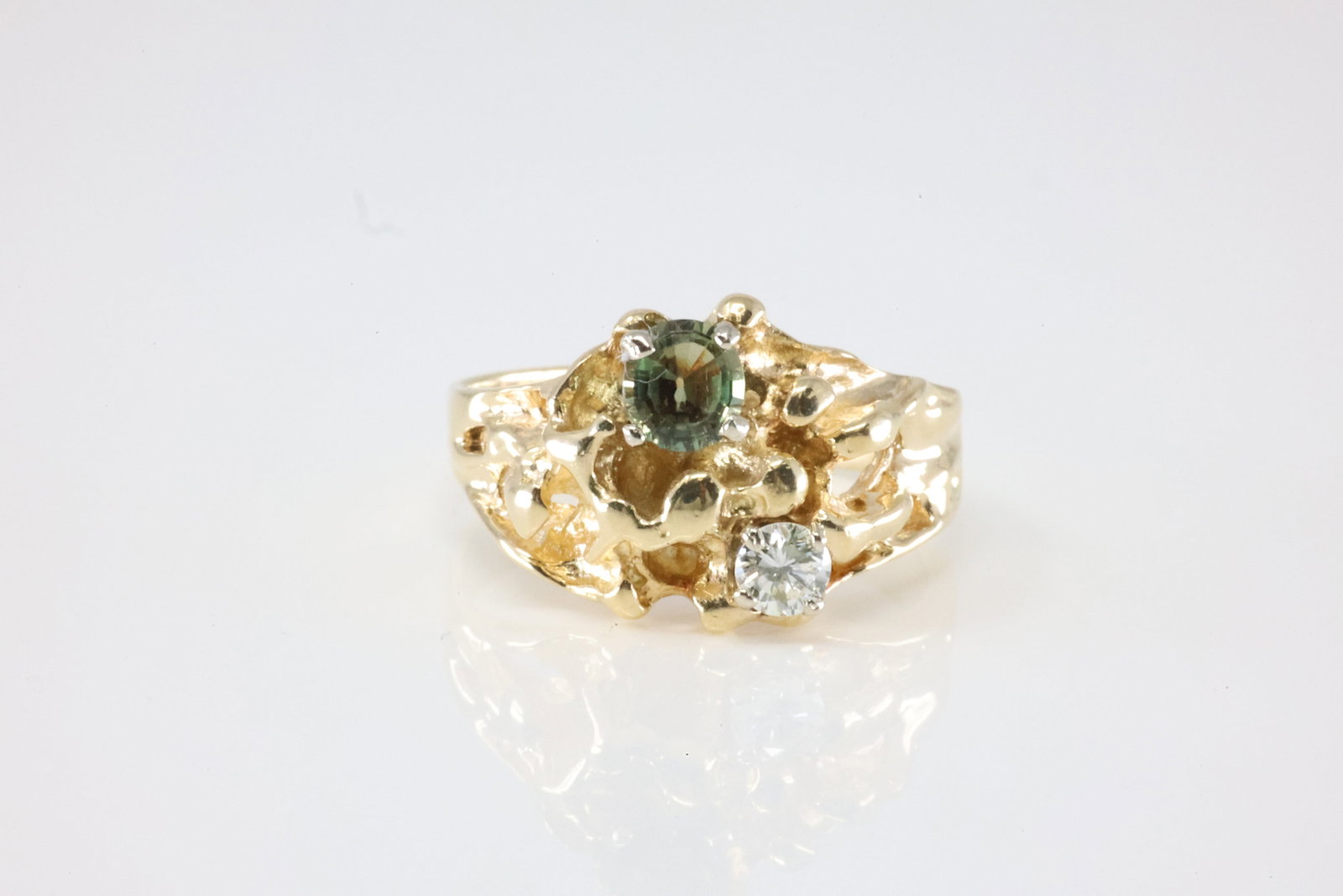 Nugget Diamond Ring: 14Kt Yellow Gold Green Color Stone & Diamond Ring. This Charming Ring has Green Stone with Sparkling Diamond. Ring size: 7.25. Total weight: 6.06 Grams.