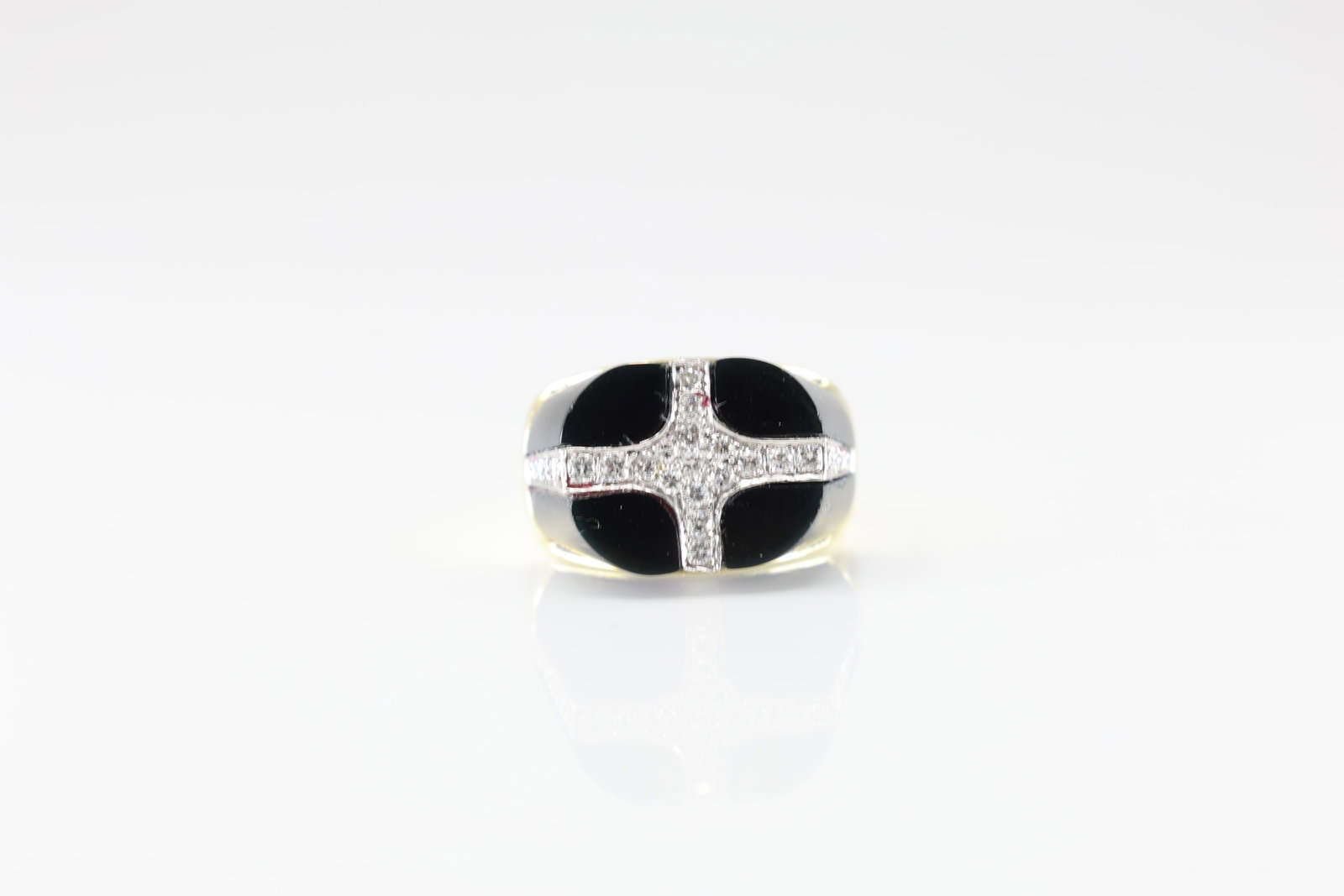 Black Onyx & Diamond Ring 14Kt.: 14Kt Yellow Gold Black Onyx & Diamond Ring. ring has a black onyx gems with unique design, elegantly intersected by a shimmering cross of 27 sparkling diamonds. this piece is ideal for those who