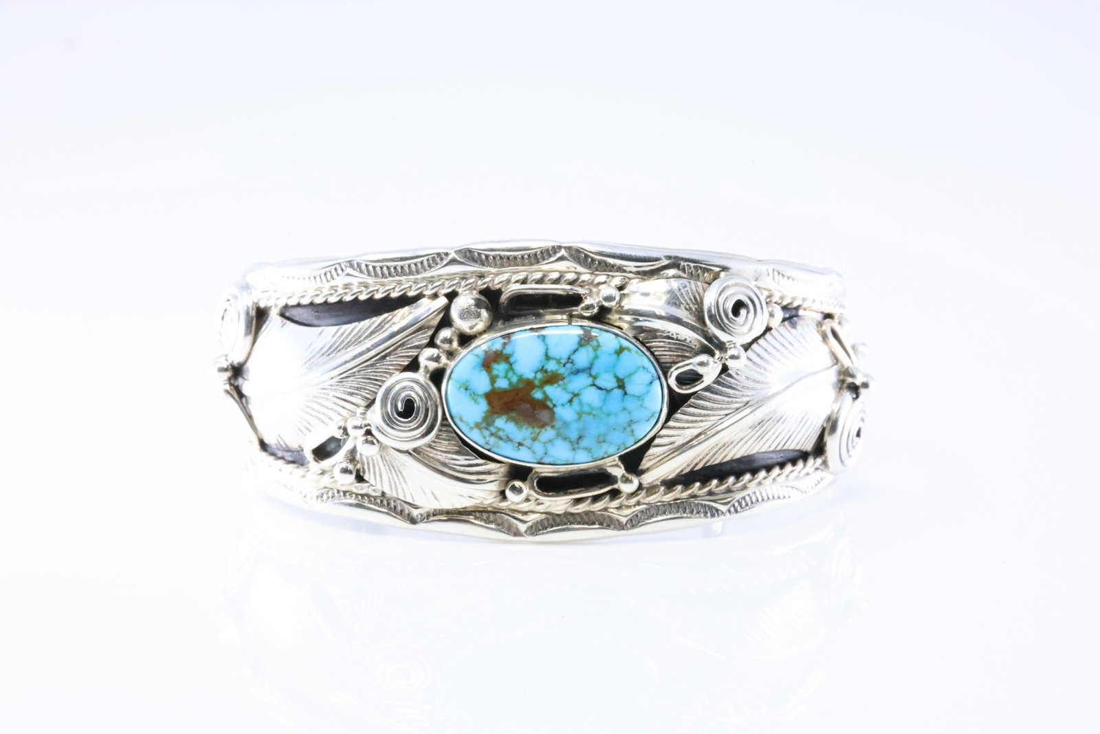 Native America Navajo Sterling Silver Turquoise Feather Bracelet Cuff By Darrell Morgan.: This is a Native America Navajo Sterling Silver Turquoise Feather Bracelet Cuff By Darrell Morgan. Stamp DM.