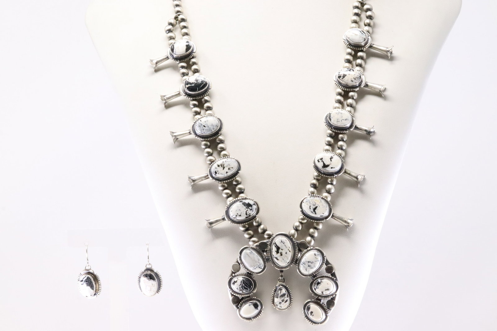 Native America Navajo Sterling Silver White Buffalo Squash Blossom Necklace & Earring's Set By: This is a Native America Navajo Sterling Silver White Buffalo Squash Blossom Necklace & Earring's Set By Thomas Francisco. Necklace length: 26.00" Total weight: 147.15 Grams.