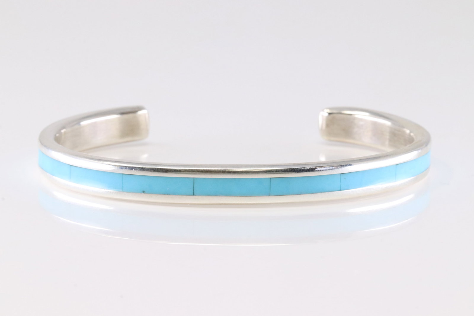 Native America Zuni Sterling Silver Turquoise Inlay Bracelet Cuff By Lawrence Lorett.: This is a Native America Zuni Sterling Silver Turquoise Inlay Bracelet Cuff By Lawrence Lorett. Stamp Lorett.