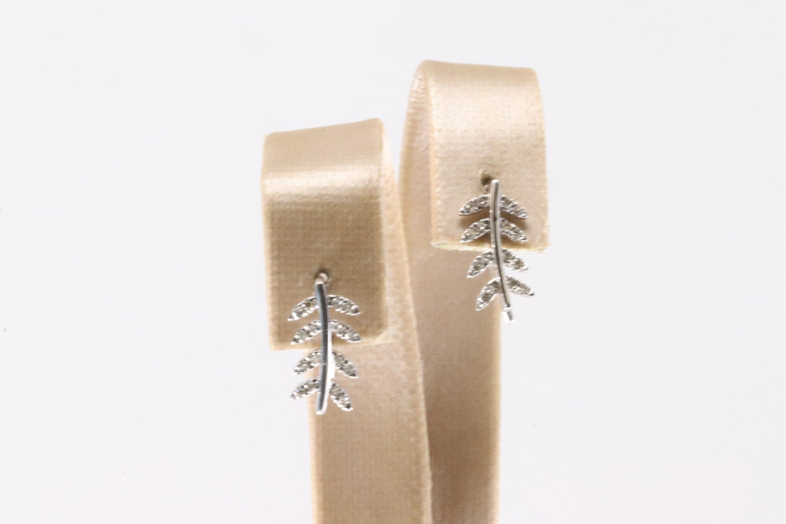 Diamond Hoop Earring 10Kt.: Ladies 10Kt White Gold Hoop Diamond Earring. This Charming Hoop Leaf Earring's has 32 round Diamonds. Diamonds weight: 0.13ctw.