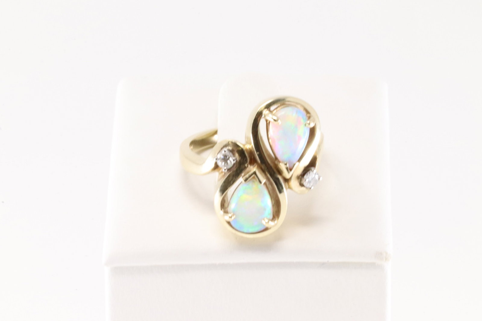 Opal & Diamond Ring 14Kt.: Ladies 14Kt Yellow Gold Opal & Diamond Ring. This Elegant Ring has 2 Pear-Shaped Opal with 2 Sparkling Diamonds. Ring size:6.25. Total weight: 9.10 Grams.