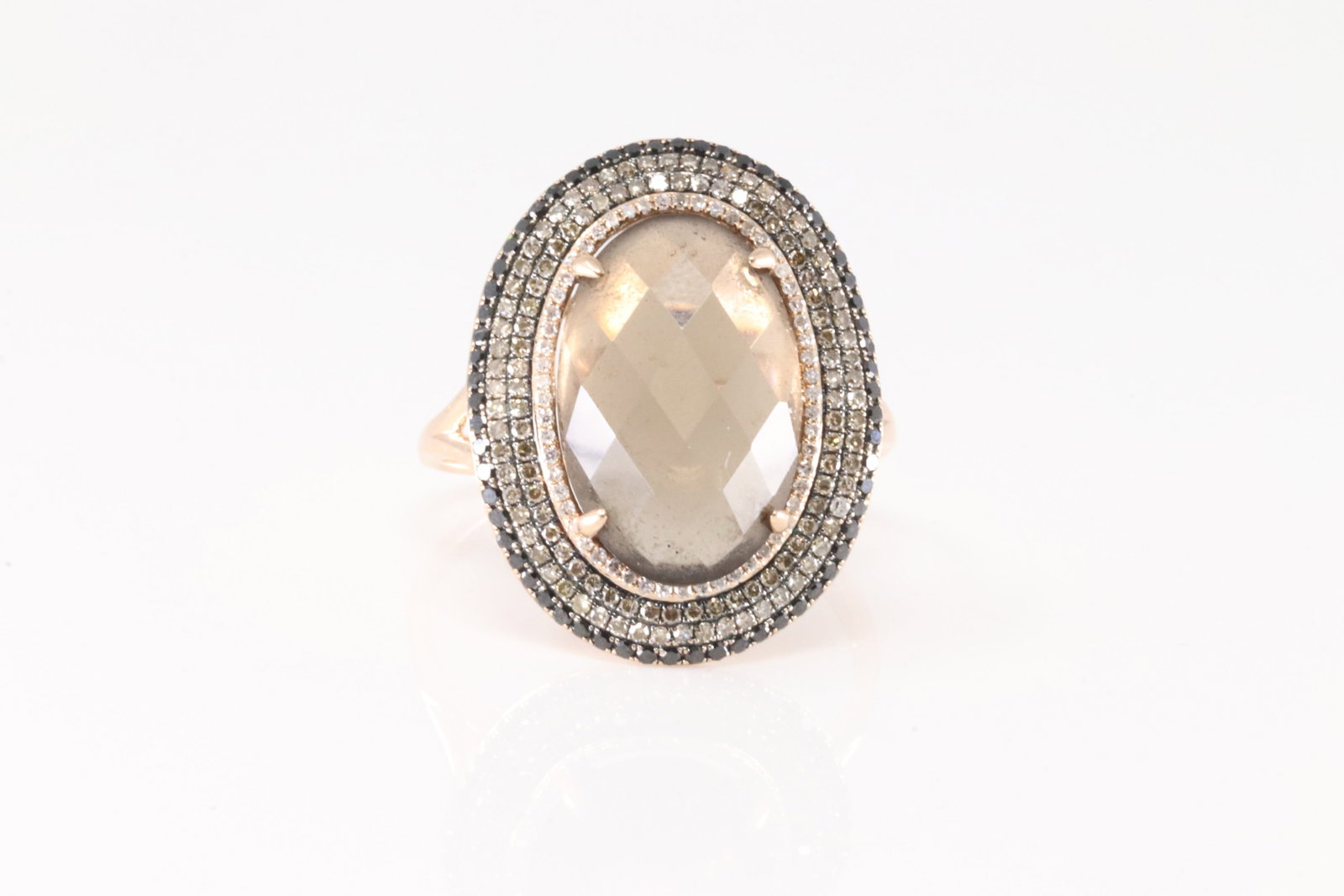 Smoky Topaz & Diamond Ring 14Kt.: 14Kt Yellow Gold Smoky Topaz & Diamond Ring. This elegant has oval smoky topaz surrender by an cocktail of black / champagne & white round brilliants diamonds. Diamonds weight approx: 2.00cttw. Ring