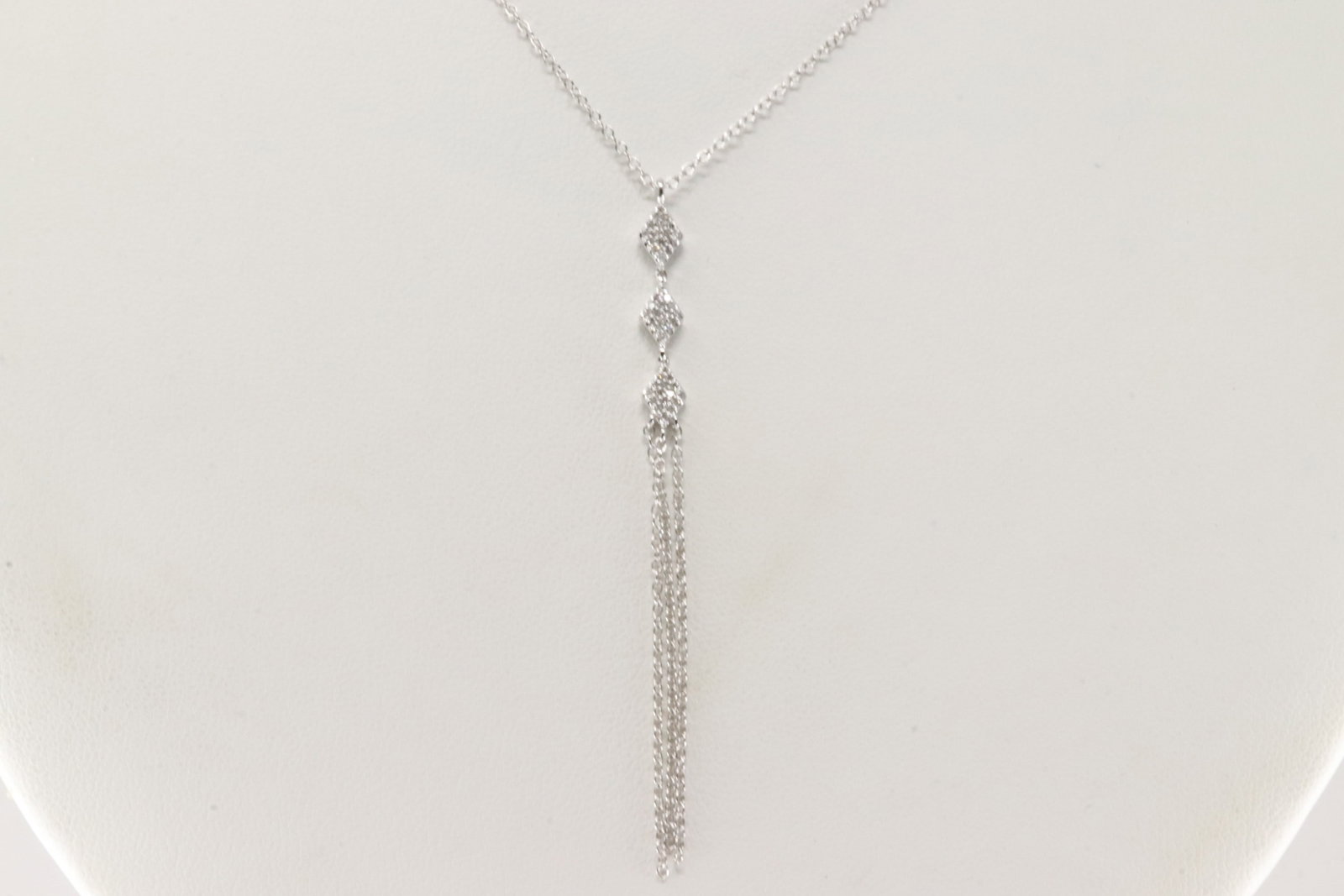 Diamond Necklace 14Kt.: Ladies 14Kt White Gold Diamond Necklace. This Necklace has A Cascade Charm with 48 round Diamonds. Diamonds weight: 0.11ctw. Necklace length: 20.00" Total weight: 2.40 Grams.