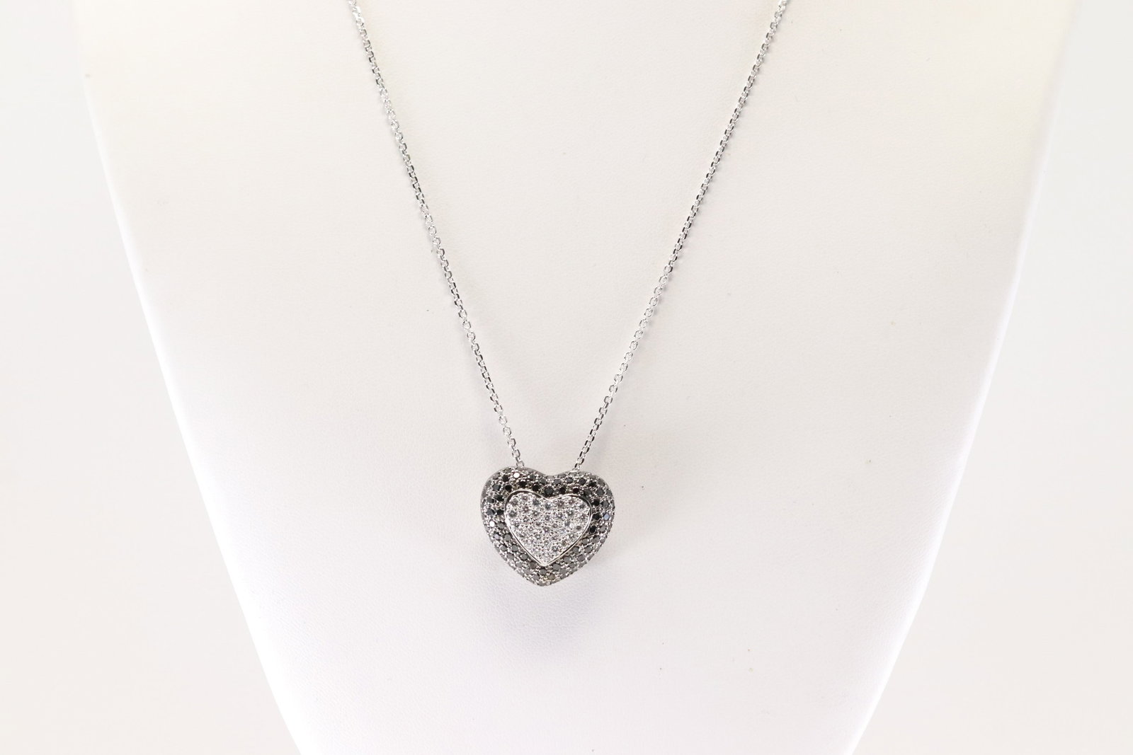Elegant Diamond Heart Pendant / Necklace 18Kt.: 18Kt White Gold Diamond Heart Pendant / Necklace. This Elegant Heart Pendant has Approx 120 Black & White Brilliants Diamonds and A 14K White Necklace. Diamonds weight approx: 3.00cttw. Necklace