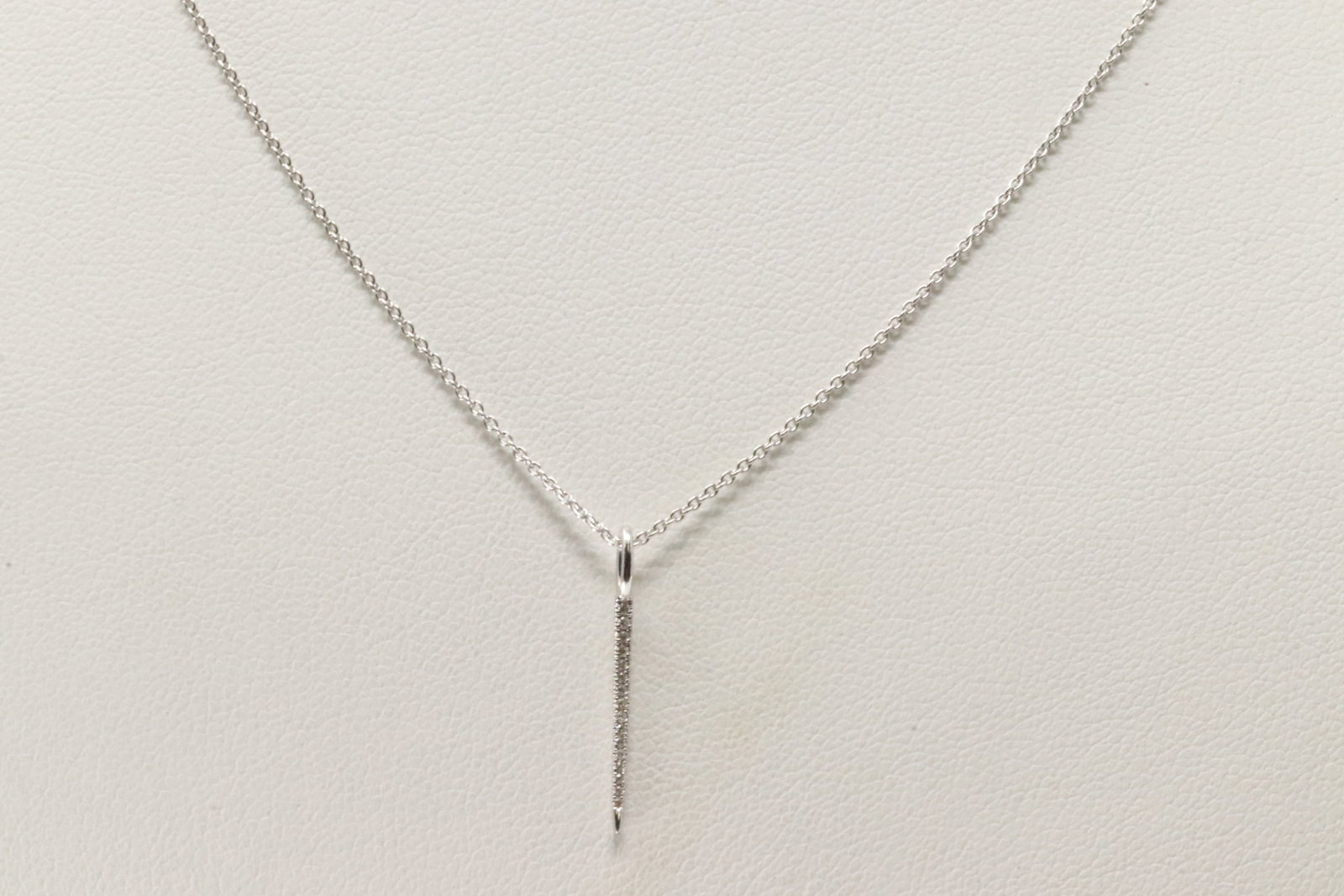 Needle Diamond Pendant / Necklace 14Kt.: 14Kt White Gold Needle Diamond Pendant / Necklace. This Needle Pendant has 16 round Diamonds with A Necklace. Diamonds weight: 0.03ctw. Necklace length: 20.00"