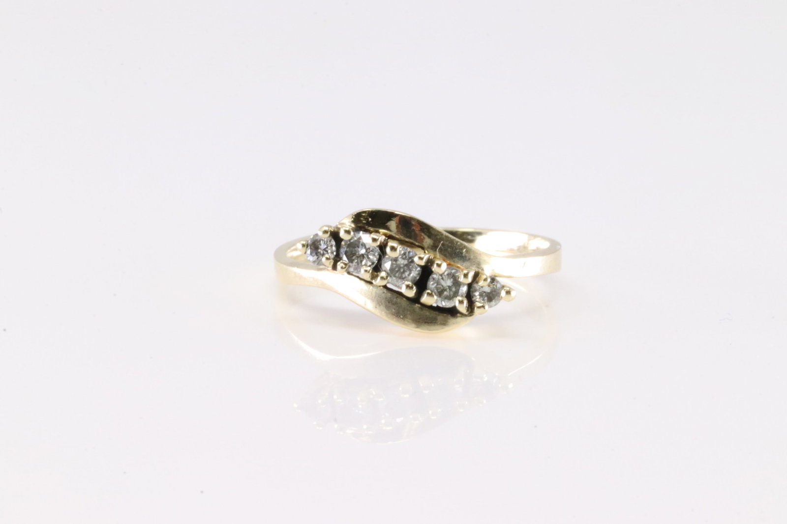 Diamond Ring 14Kt.: Ladies 14Kt Yellow Gold Diamond Ring. This Charming Ring has 5 Sparkling Diamonds. Ring size: 5.00.
