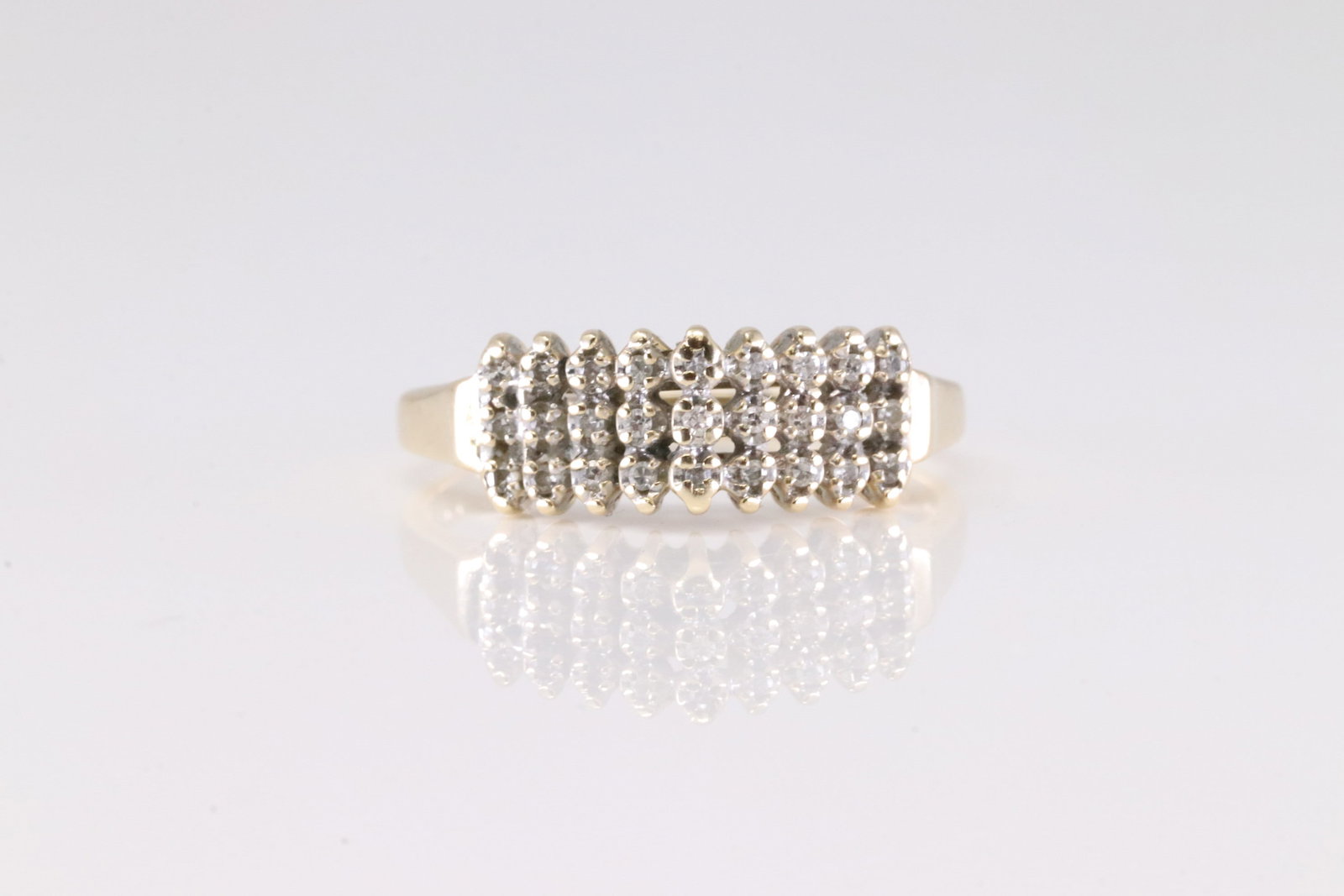 Diamond Ring 10Kt.: Ladies 10Kt yellow Gold Diamond Ring. This Charming Ring has 3 rows with Sparkling Diamonds. Ring size: 7.50. Total weight: 2.68 Grams.