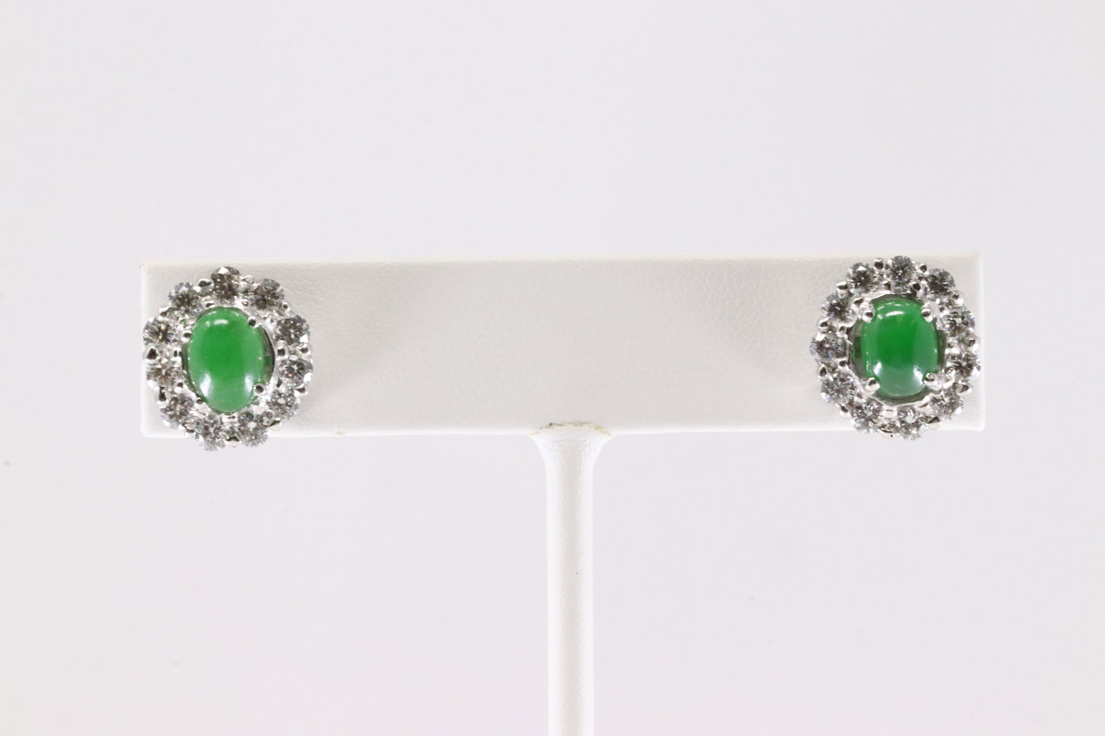 Jade & Diamond Stud Earring 18Kt.: Ladies 18Kt White Gold Jade & Diamond Stud Earring. This Elegant Stud Earring has Green Jade Stone Surrender by 11 Brilliants Natural Diamonds on To each. Jade Measure: 7.30 x5.70 mm. Diamonds weight
