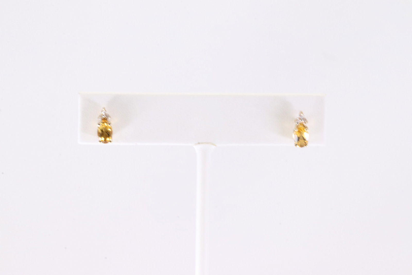 Citrine & Diamond Stud Earring 10Kt.: Ladies 10Kt Yellow Gold Citrine & Diamond Stud Earring. This Charming Stud Earring's has Yellow Citrine Gemstone with Sparkling Diamonds.