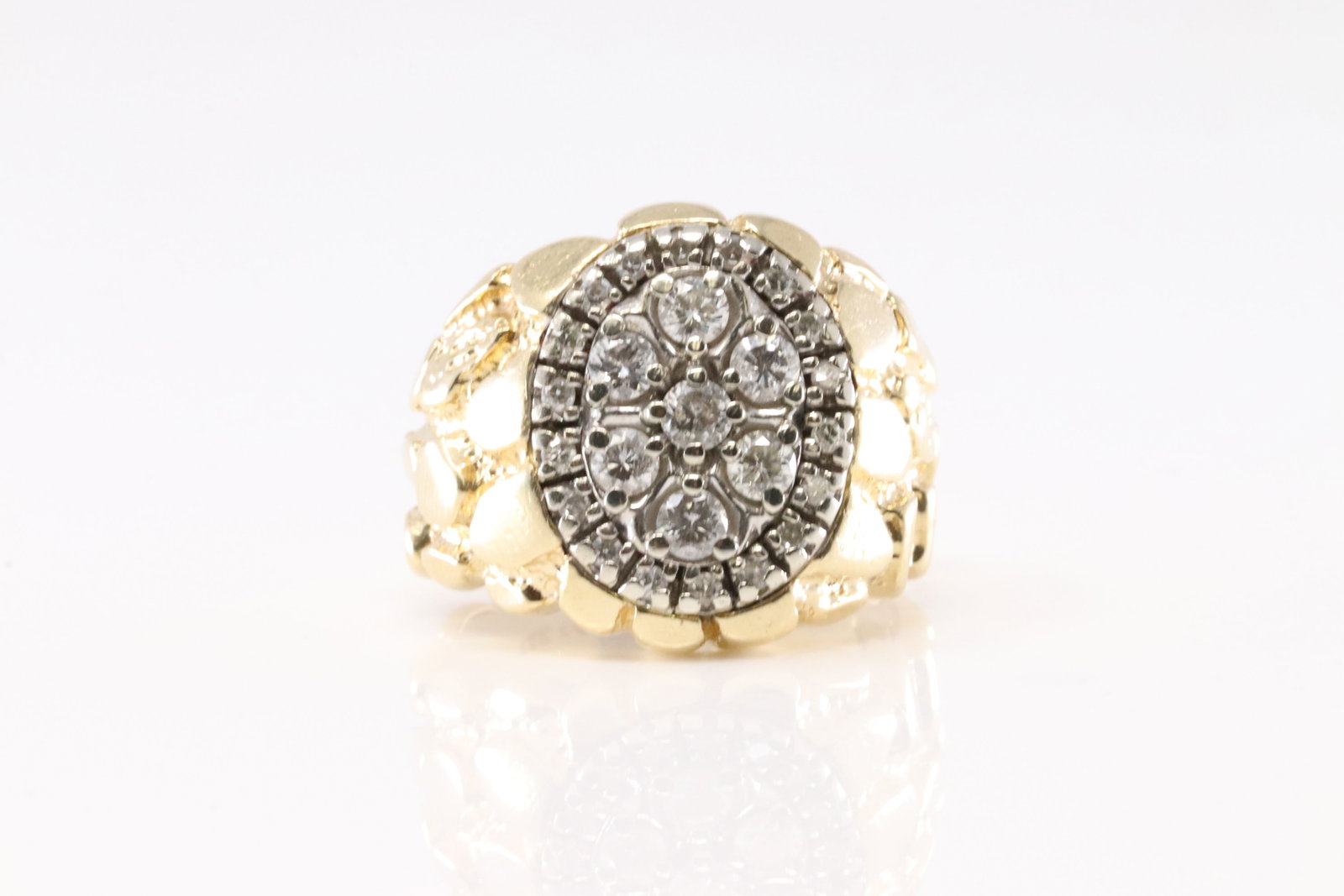 Nugget Diamond Ring 14Kt.: Ladies 14Kt Yellow Gold Nugget Diamond Ring. This Ring has a Nugget Design With 25 Brilliant Diamonds. Diamonds Approx Weight: 0.95ctw. Ring Size: 9.00. Total Weight: 13.60grams.